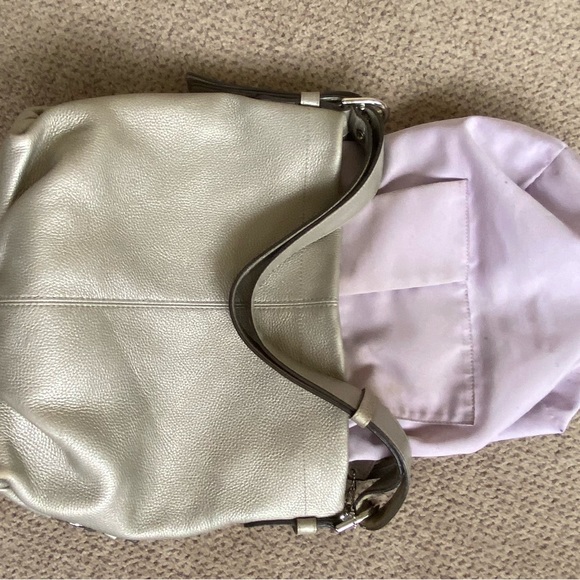 Coach metallic in soft neutral hobo bag. Zip top and side. Adjustable strap. - Picture 9 of 12